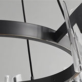"Close-up of the black brass frame of a modern chandelier with acrylic shades."