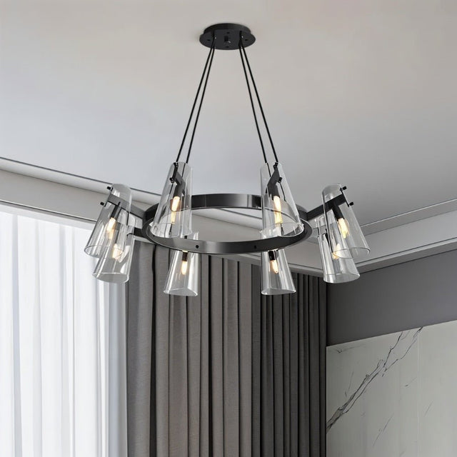 "A modern black brass chandelier with cone-shaped acrylic shades in a living room with curtains."