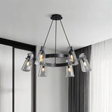 "A modern black brass chandelier with cone-shaped acrylic shades in a contemporary room."