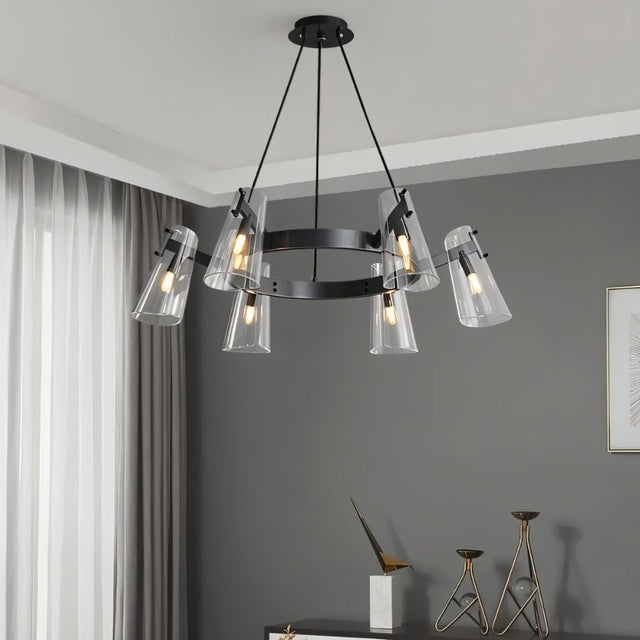 "A modern black brass chandelier with cone-shaped acrylic shades hanging in a living room."