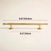 Brass pull bar with round knobs on beige background, showing 9.8" overall length and 6.3" center-to-center spacing.