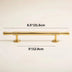 Gold polished brass cabinet pull bar with cylindrical handles on a neutral beige background.