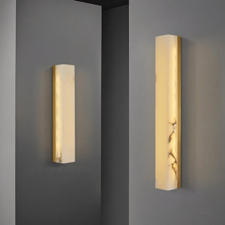 "Two sizes of the Emerson brass wall lamp, showcasing the design's versatility for different spaces and lighting needs."