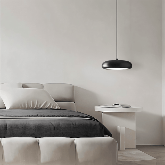 Emiva Pendant Light featured in a neutral-toned bedroom, adding a sleek and modern lighting touch to the space.