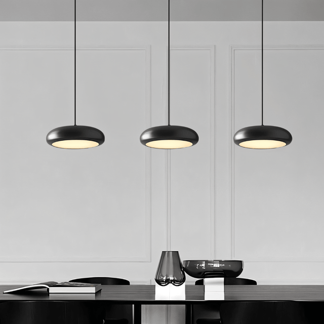 Set of three Emiva Pendant Lights above a dining table, offering balanced LED lighting for contemporary dining room interiors.
