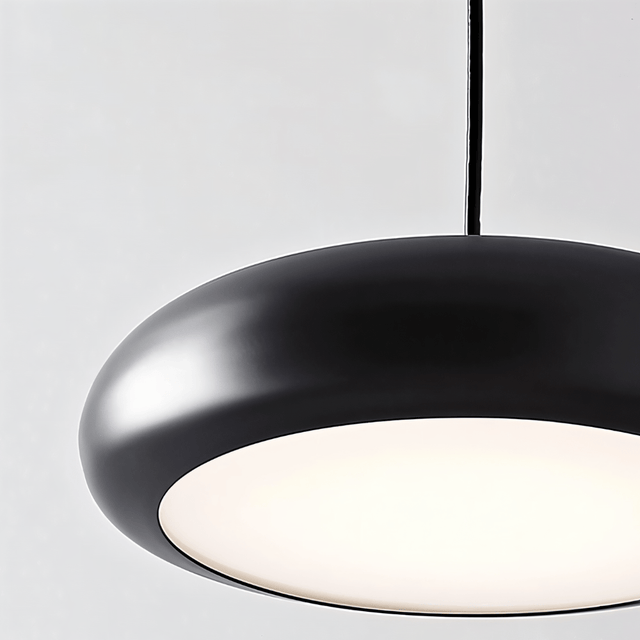 Detailed view of Emiva Pendant Light's LED diffuser, emphasizing its soft glow and modern acrylic and metal build.