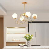 "Orbit-inspired ceiling chandelier with soft ambient lighting, enhancing a stylish living room interior."