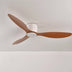 Three-bladed ceiling fan with walnut wood blades and white motor housing mounted on white ceiling.