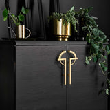 "close-up of Enoch pull bar with geometric design and sleek lines"