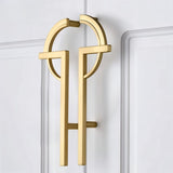 "brass pull bar mounted on stylish door with geometric accents"