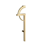 "A gold geometric pull bar handle on a white background."