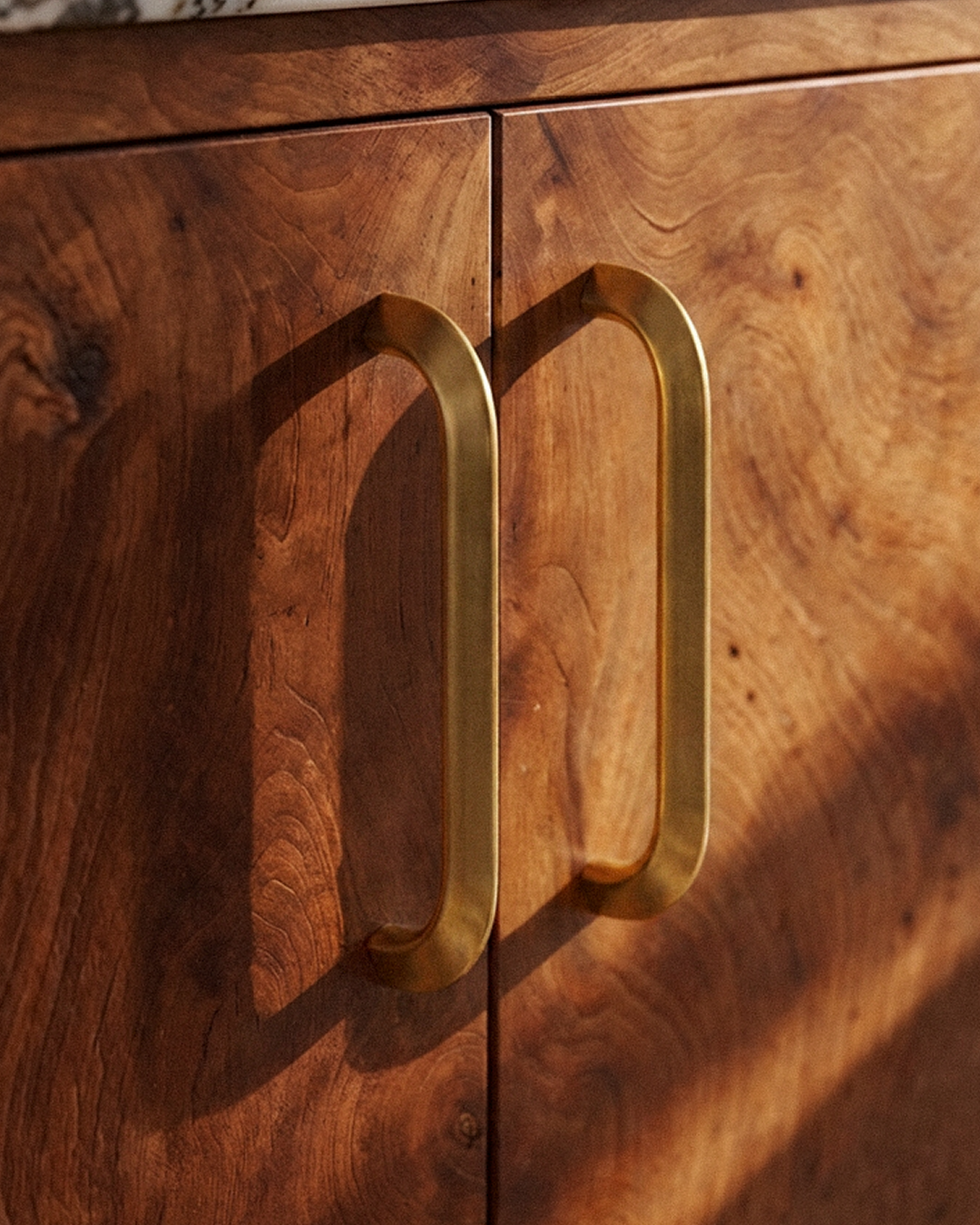 Enzo Cabinet Pull in Satin Brass, on a plain background
