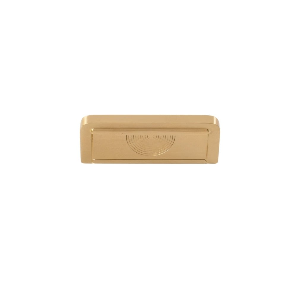 "A textured brass Erdas pull bar handle on a white background."