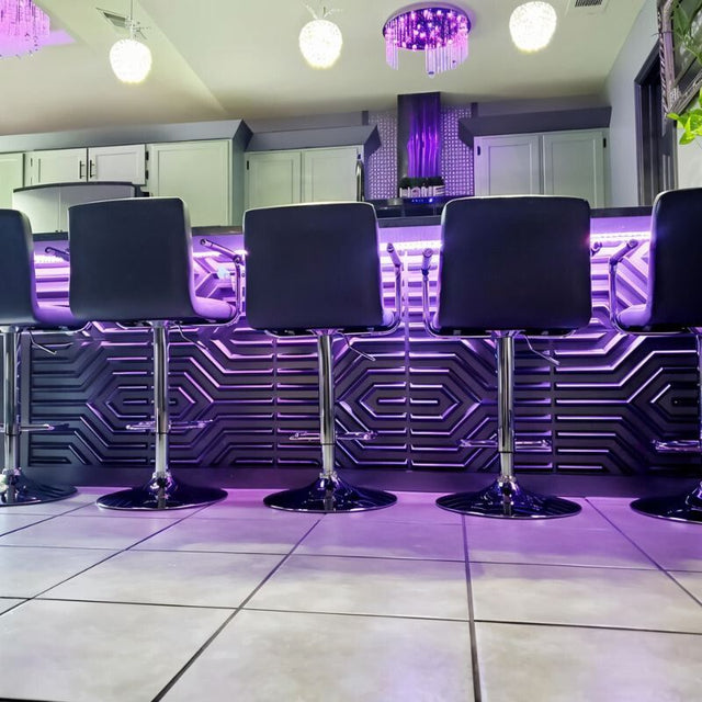 Modern kitchen bar with black Erial PVC Wall Panels and purple LED lighting, offering a bold, DIY-friendly decorative solution.