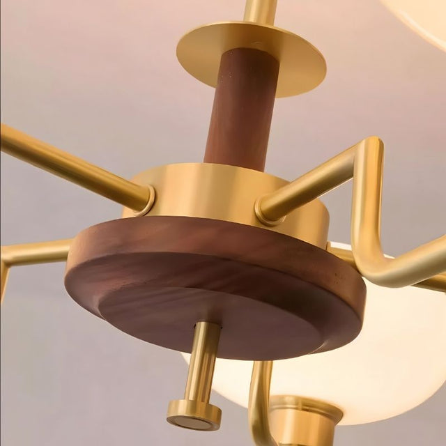 "Close-up detail of a brass and wood chandelier, showing the central wooden and brass components."