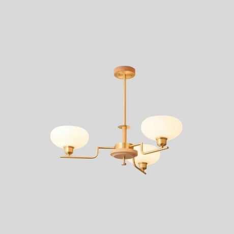 "Brass and wood chandelier with three white globe-shaped glass shades, isolated on a gray background."