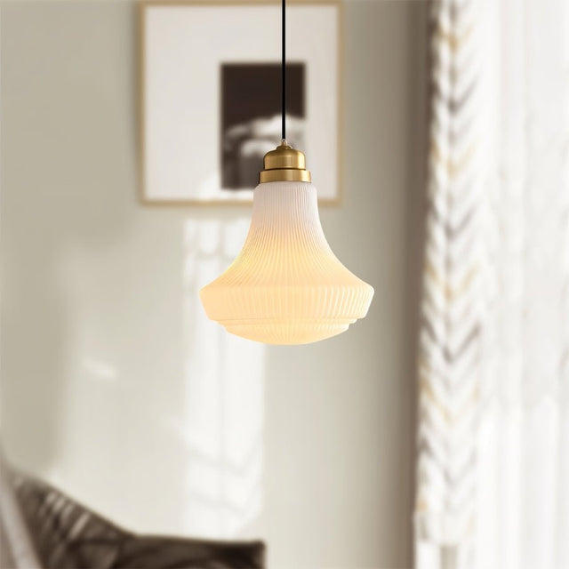 "Retro pendant light with a bell-shaped, striped glass shade and a brass or iron finish, providing a warm, inviting ambiance with a unique play of light and shadow."