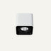 White and black cylindrical downlight fixture with adjustable spotlight on neutral background.