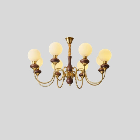 "Gold and dark wood Eurot chandelier with six frosted glass globes, isolated on a light gray background."