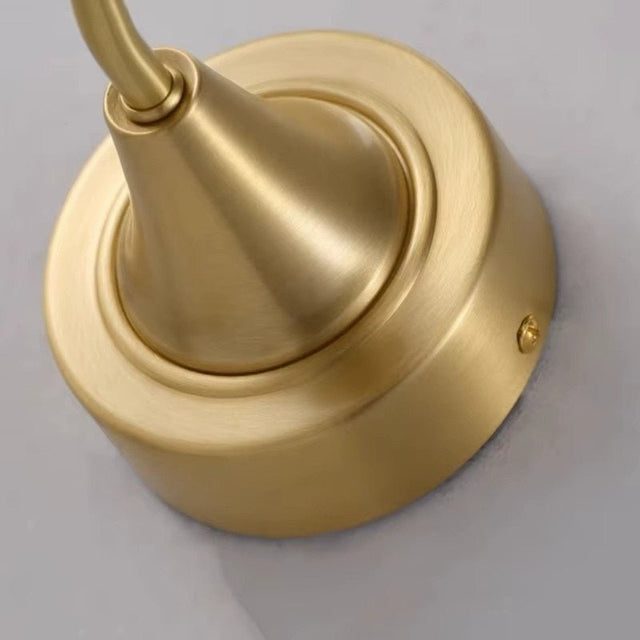 "Close-up of a sleek gold wall lamp base showcasing its modern design and durable construction."
