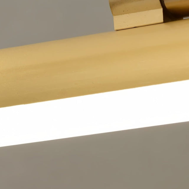 "Close-up of a sleek gold horizontal light bar emitting a soft, even glow from a contemporary wall lamp, showcasing its minimalist design."