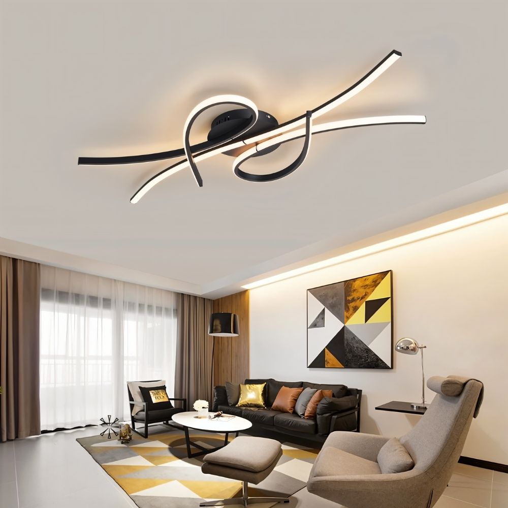  "A modern black ceiling light with intertwining LED bars in a contemporary living room with a geometric rug and artwork."