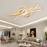 "A modern ceiling light with intertwining LED bars in an open-plan living and dining area with contemporary furniture."