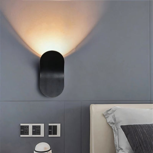 Fana Artistic Wall Lamp: Featuring a unique and artistic design, this wall lamp doubles as a statement piece of decor, casting intriguing shadows and patterns on the wall when lit.