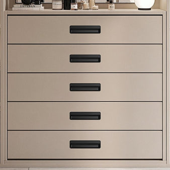 "Black recessed drawer pulls made of aluminum alloy on a light beige contemporary dresser with multiple drawers."