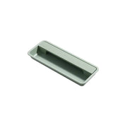 "Green recessed rectangular drawer pull made of aluminum, sleek minimalist design."