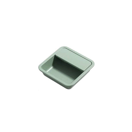 "Green aluminum recessed drawer pull with a minimalist design, isolated on a white background."