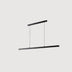 Black linear pendant light with two horizontal bars suspended by cables against a neutral background.