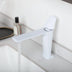 White single-handle bathroom faucet displayed on a marble countertop with cosmetic accessories.