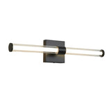 "A modern black wall lamp with a clear glass tube shade, isolated on a white background."