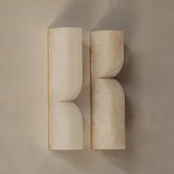 "A pair of double-curved alabaster wall lamps, showcasing a modern design."