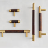 "Set of wood and brass knobs and pull bars with cylindrical design on a white background."