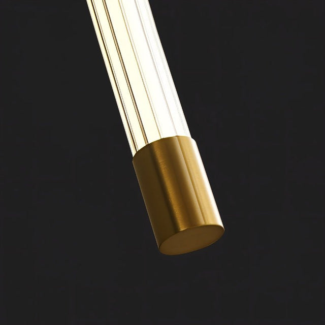 "Close-up of a modern wall lamp showing the brass end cap and acrylic diffuser, highlighting the materials and minimalist design."