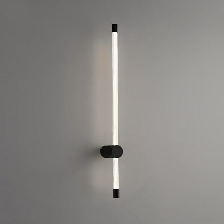  "A sleek, vertical black wall sconce with a long, thin light bar and acrylic diffuser, mounted on a gray wall."