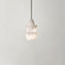 Alabaster pendant light with stacked geometric shades hanging from dark cord against white background.