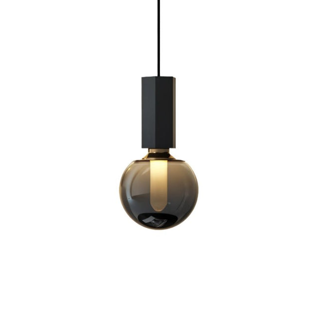 "Modern pendant light with a concrete rectangular top, metal accent, and smoky glass orb, showcasing a minimalist and sophisticated design."