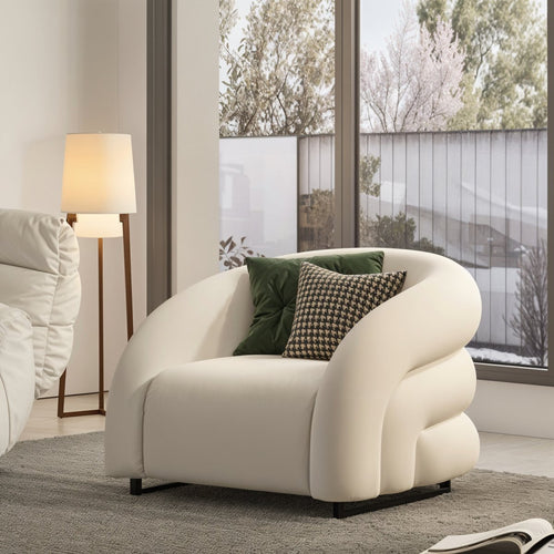 Fotel Scandinavian Chic Accent Chair: This accent chair features clean lines, a minimalist silhouette, and light wood legs, embodying the simplicity and elegance of Scandinavian design.