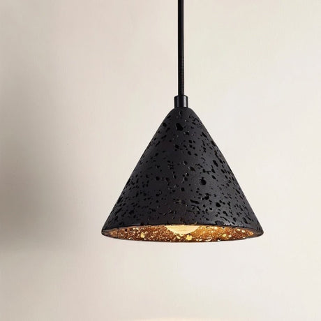 "A conical black travertine pendant light, isolated on a light background, showing the stone's texture and warm light."