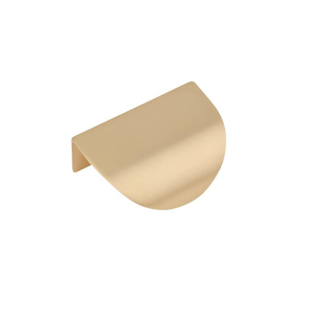 "A minimalist gold drawer pull on a white background."