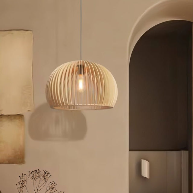 "Wooden pendant light with slatted dome design, hanging gracefully beside an arched wall, casting a warm and inviting glow in contemporary interiors."