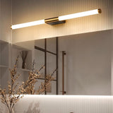 "A modern, linear LED vanity light mounted horizontally above a bathroom mirror with decorative elements."