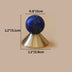 Blue lapis lazuli sphere on brass cone base with dimensions labeled on beige background.