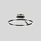 "A modern LED ceiling light with interlocking black rings, shown against a light gray background."