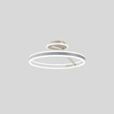 "A modern LED ceiling light with interlocking white rings, shown against a light gray background."