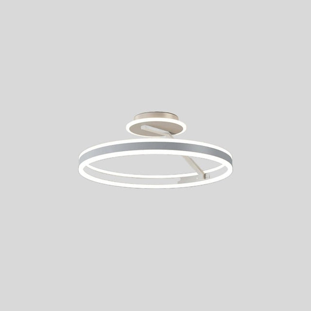 "A modern LED ceiling light with interlocking white rings, shown against a light gray background."