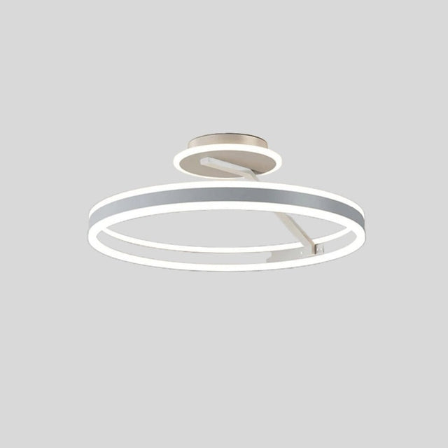 "A modern LED ceiling light with interlocking white rings, shown against a light gray background."
